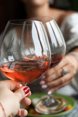 Cheers! A romantic dinnder for two: glasses of wine, a tasty and nutritious dinner.