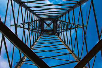abstraction from aluminum power line design on a blue background
