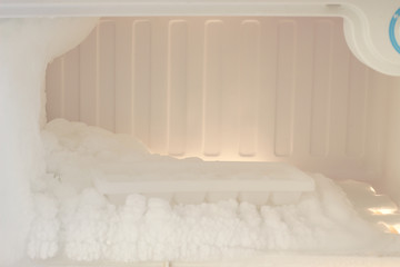 Fototapeta na wymiar Ice on freezing compartment of refrigerator.