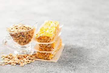 Different Energy protein bar on grey background.  Healthy granola bars (muesli or cereal bars).