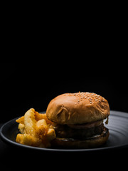 Hamburger in black background.