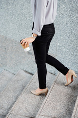 Businesswoman walking down stairs