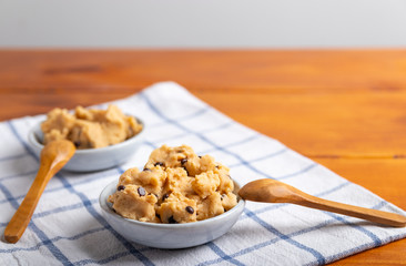 a serving of homemade cookie dough on a white background.