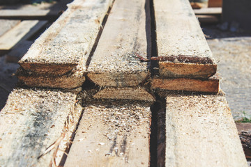 Worker sawing a Board that folded