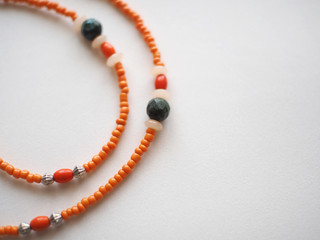 Bracelet and Necklace : Mixed beads isolated on white background  :  Blurred, soft focus