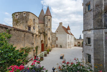 Fototapeta na wymiar CHATEAUNEUF / FRANCE - JULY 2015: View to the inner yard of medieval castle of Chateauneuf-en-Auxois town, France