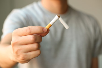 Male hand deduct cigarette.Quitting from addiction conceptQuit smoking  breaks a broken  Stop Smoking 