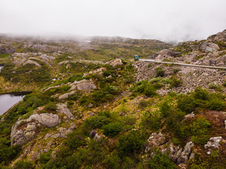 Couple tourists in mountains Norway