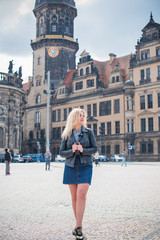 Stylish woman walking on the city street. Casual fashion, fashionable look. Plus size model. Happy lady walking the city streets 