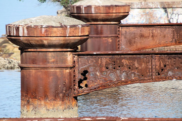 Naklejka premium Old Derelict Bridge Pylon Supports in River Brisbane Waters at Gosford Australia