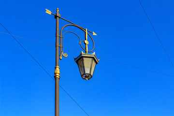 Lamppost against the sky