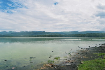 Lake against a mountain and forest background, Lake Elementaita, Kenya