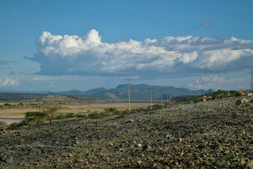 Arid landscape against a mountain background, Lake Magadi, Kenya