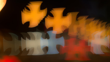 Bokeh background pattern in the shape of a cross