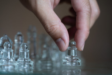 Chess board game made of glass, business competitive concept