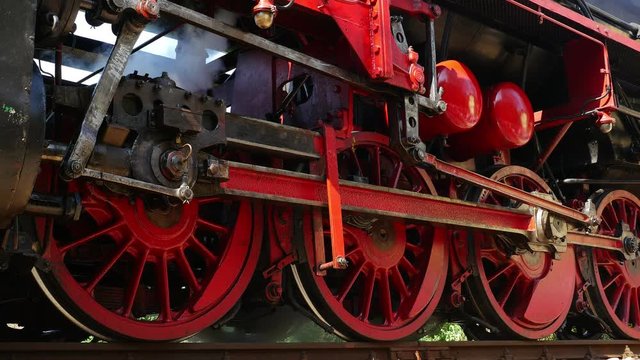 Detail of an old steam engine train locomotive. Nostalgic historical retro vintage technology background, 4k slow motion