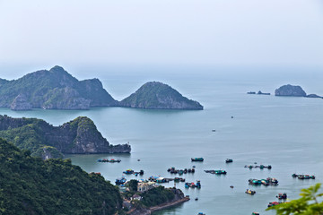 Halong bay islands floating village South China Sea Vietnam. Sit