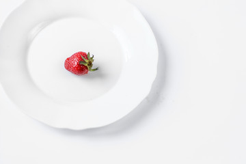 strawberries on a white plate