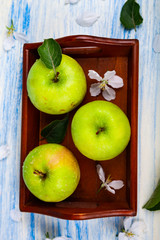 Green apples, flowers and leaves