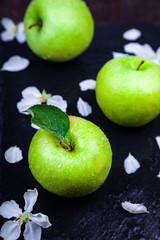 Green apples, flowers and leaves