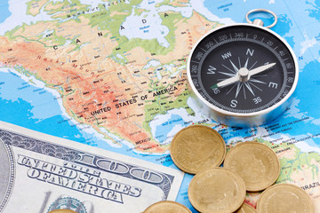 Fototapeta na wymiar Financial Concept : US Dollar Coin and Compass on America Map Background.