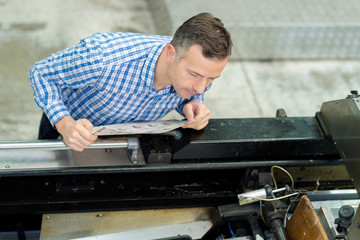 man working in printing factory