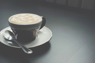 hot cappuccino coffee latte on wood table.