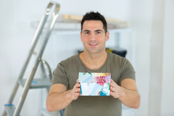 man showing house model isolated on white