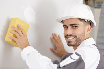 man washing a wall