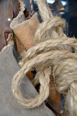 ropes and bags hanging on the wall