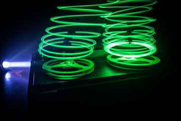 Old vintage reel to reel player and recorder on dark toned foggy background. Analog Stereo Open Reel Tape Deck Recorder Player with Reels.