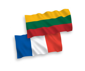 National vector fabric wave flags of France and Lithuania isolated on white background. 1 to 2 proportion.