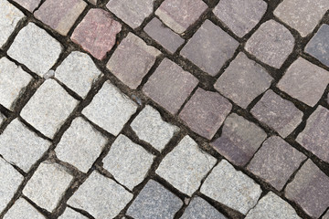 old road sidewalk paved with granite of different colors