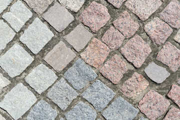 old road sidewalk paved with granite of different colors