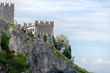 Fototapeta na wymiar Mediaeval castle on top of a cliff at wonderful lakeside