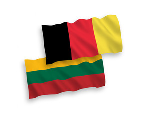 National vector fabric wave flags of Lithuania and Belgium isolated on white background. 1 to 2 proportion.