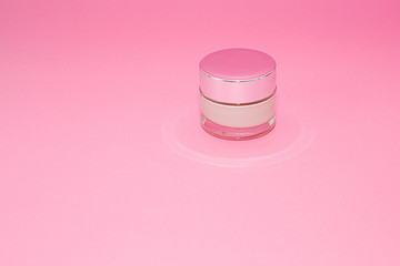 Beauty luxury cosmetic cream container on pink background . Beauty background with facial cosmetic products. Package for cream. Branding mock up. Beauty and spa concept