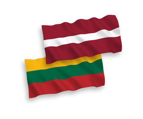 National vector fabric wave flags of Latvia and Lithuania isolated on white background. 1 to 2 proportion.