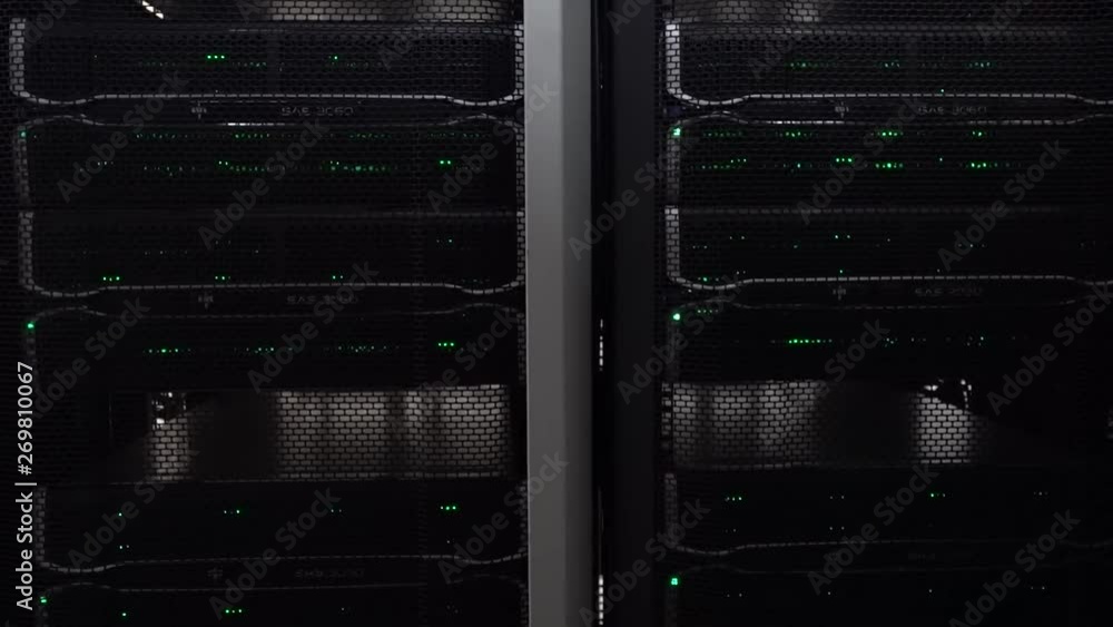 Poster dark modern working data servers with flashing led green lights.