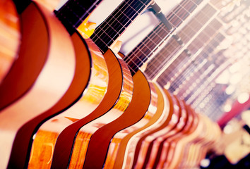 long line of new acoustic guitars in store