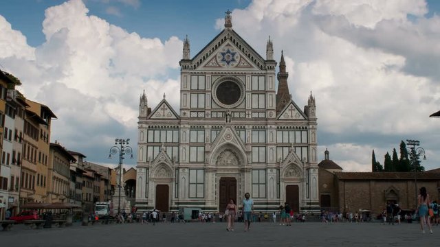 Time-lapse of Basilica of the Holy Cross (Basilica di Santa Croce) with people in the square. Florence, Italy. Time-lapse 4K UHD Video. 