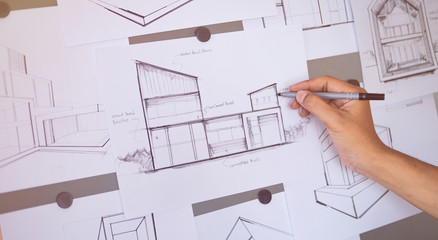 Architect Designer Engineer sketching drawing draft working Perspective Sketch  design house construction Project