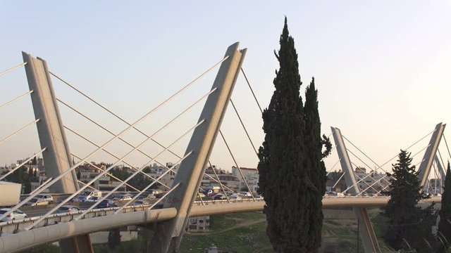 Car traffic on the Wadi Abdoun Bridge, a cable-stayed bridge in Amman, Jordan