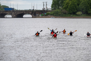 a group of canoeists breaks out for a trip on the water