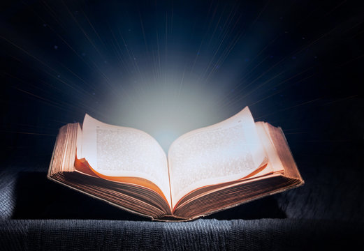 open magic book, blue cool white light from a book, magic, true knowledge, light of science
