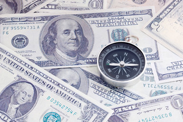 Financial Concept : US Dollar and Compass.