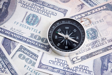 Financial Concept : US Dollar and Compass.