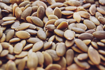 Raw pumpkin seeds background.