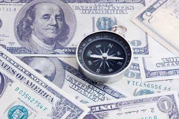 Financial Concept : US Dollar and Compass.