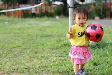 Happy Asian baby child girl playing with many toy at the playground. Kid and sport concept.